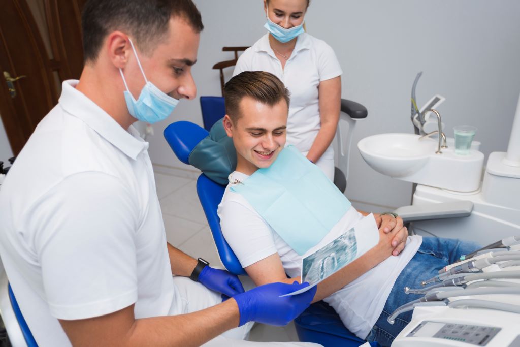 Dentist Patient Smiling Looking Radiography